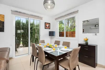 a dining room with a table and chairs at Villa Anais - 3-Bed Villa with Private Pool in Paralimni