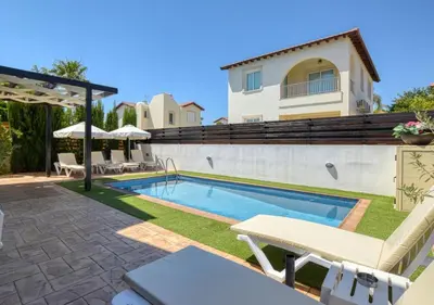a swimming pool in the backyard of a house at Villa Anais - 3-Bed Villa with Private Pool in Paralimni