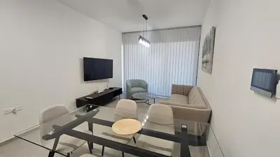 a living room with a couch and a table at STAY Engomi Gem 1 in Engomi