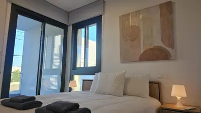 a bedroom with a bed with two pillows on it at STAY Engomi Gem 1 in Engomi