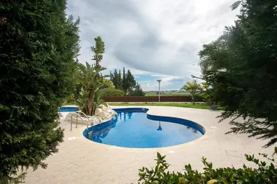 a swimming pool in the middle of a yard at Modern & Fancy ground floor Studio - Pool & Relax in Tersephanou