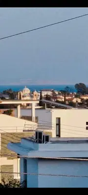 a view of a city from the roof of a building at 3 Bedroom Penthouse Livadia Larnaca in Livadhia