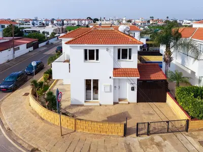 a white house with a red roof at Villa St George - 3 Bed Villa with Private Pool in Xylophaghou