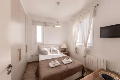 a bedroom with two beds with towels on them at Protaras Seaside Villa Narcissos 2 in Protaras