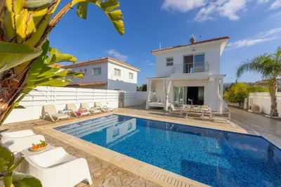 a villa with a swimming pool and a house at Protaras Villa Alina in Protaras