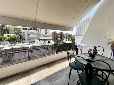 a balcony with a table and chairs on a roof at STAY Sunsea Studio in Limassol