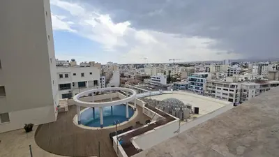 a view of a city from a building at Sea View Apartment Finikoudes in Larnaka