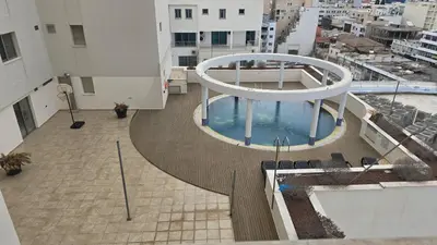 an overhead view of a balcony with a pool on a building at Sea View Apartment Finikoudes in Larnaka