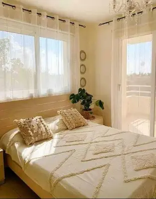 a bedroom with a large bed with two pillows on it at Summer Breeze apt by Nissi Beach in Ayia Napa