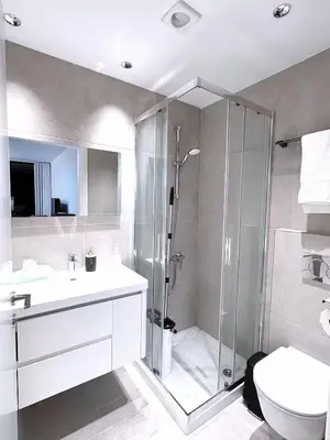 a bathroom with a shower and a sink and a toilet at Luna Mare in Limassol
