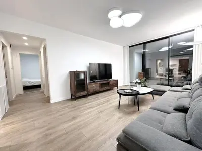 a living room with a couch and a tv at Luna Mare in Limassol