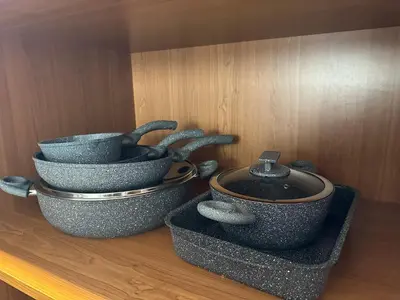 a group of bowls sitting on top of a shelf at CityLink-3Bedrooms Appartment CityCenter in Limassol