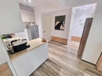 a kitchen with a counter top and a refrigerator at 1, bed Kapparis, Triumph 1 - A in Paralimni