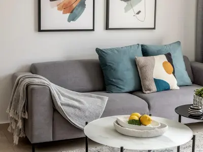 a living room with a couch and a table with fruit on it at Mythical Sands AL14 in Paralimni