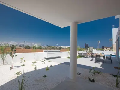 a patio of a house with a table and chairs at Holiday Home Protaras Vie Bleu Villa mit Pool- im Zentrum by Interhome in Protaras