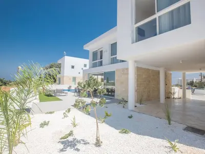 an image of a house with a courtyard at Holiday Home Protaras Vie Bleu Villa mit Pool- im Zentrum by Interhome in Protaras