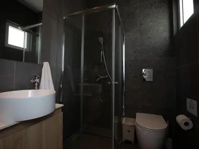 a bathroom with a shower and a toilet and a sink at Holiday Home Bleu Vie in Protaras by Interhome in Protaras