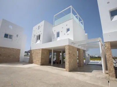 a large white building with a staircase on it at Holiday Home Bleu Vie in Protaras by Interhome in Protaras
