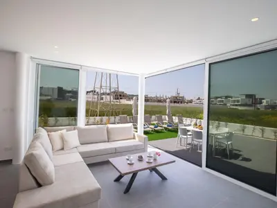a living room with a couch and a table at Holiday Home Bleu Vie in Protaras by Interhome in Protaras