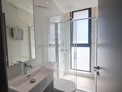 a bathroom with a sink and a toilet and a mirror at Holiday Home Protaras Almaria Villa ALM08 by Interhome in Protaras
