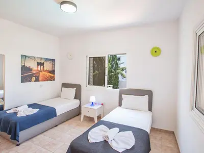a bedroom with two beds and a window at Holiday Home in Protaras mit privatem Parkplatz by Interhome in Protaras