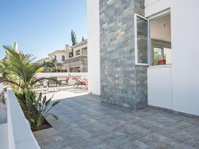 a patio of a house with a brick wall at Holiday Home Protaras Perle Villa PE15 by Interhome in Protaras