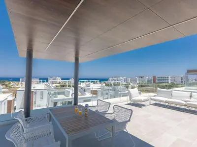 a patio with a table and chairs on a roof at Holiday Home Protaras Olivine Villa OL9 by Interhome in Protaras