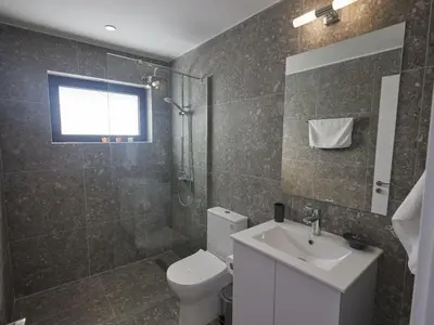 a bathroom with a toilet and a sink and a shower at Holiday Home Protaras Elite Perle Villa EP3C by Interhome in Protaras