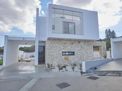 a modern house with a stone facade at Holiday Home Protaras Elite Perle Villa EP3C by Interhome in Protaras
