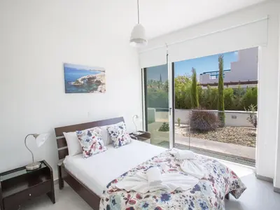 a bedroom with a bed and a large window at Holiday Home Protaras Greco Villa CCV2 by Interhome in Protaras