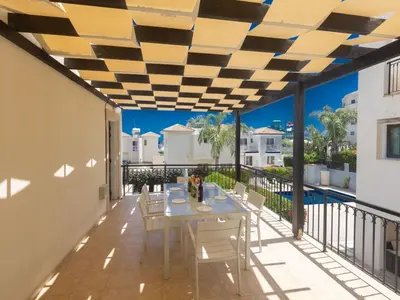 a patio with a table and chairs on a balcony at Holiday Home Ferienvilla für 10 Personen in Protaras by Interhome in Protaras