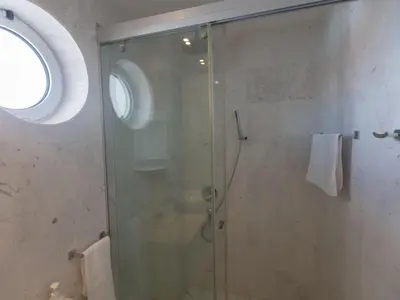 a shower with a glass door in a bathroom at Apartment Luxuriöse Wohnung am Strand von Thalassa by Interhome in Protaras