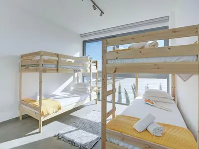 two bunk beds in a room with a window at Holiday Home Protaras Ferienvilla mit privatem Pool- Whirlpool by Interhome in Paralimni