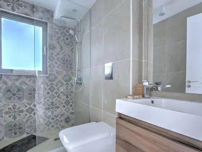 a bathroom with a toilet and a sink at Holiday Home Protaras Ferienvilla mit privatem Pool- Whirlpool by Interhome in Paralimni
