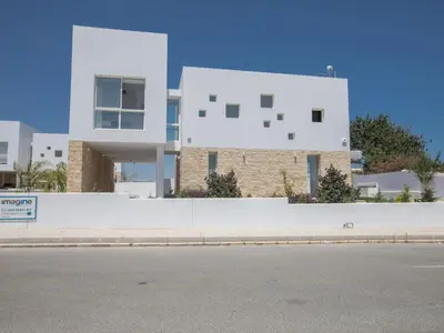 a white building on the side of a street at Holiday Home Protaras Vie Bleu Villa VB5 by Interhome in Protaras