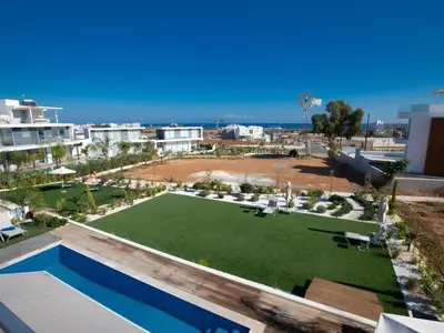 a resort with a lawn and a swimming pool at Holiday Home Ferienvilla Olivine Pearl mit Meerblick by Interhome in Protaras