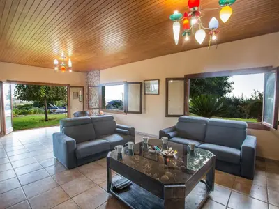 a living room with two couches and a table at Holiday Home Private Villa mit Panoramablick auf das Meer by Interhome in Protaras
