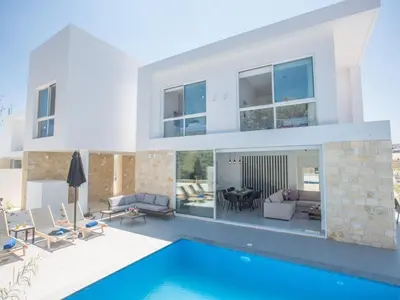a villa with a swimming pool and a house at Holiday Home 4-Schlafzimmer-Villa mit Pool im Zentrum von Protaras by Interhome in Protaras