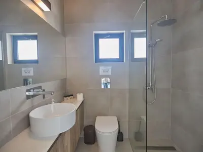 a bathroom with a sink and a toilet and a shower at Holiday Home Protaras Aqua Pearl Villa AQ11 im Zentrum by Interhome in Protaras