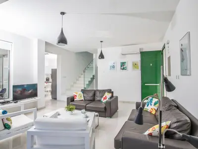 a living room with two couches and a tv at Holiday Home Neue Ferienvilla für 10 Personen by Interhome in Protaras