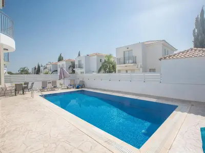 a swimming pool in the backyard of a villa at Holiday Home Ferienvilla PV17 mit Sonnenterrasse und Pool by Interhome in Protaras