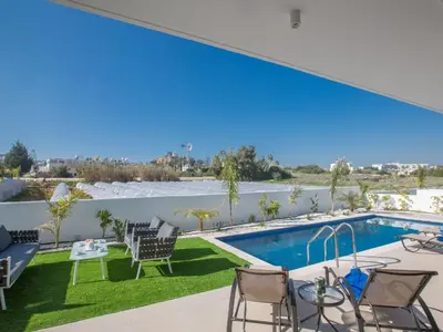 a view from the balcony of a house with a swimming pool at Holiday Home 3-Schlafzimmer-Villa mit privatem Pool im Zentrum by Interhome in Protaras