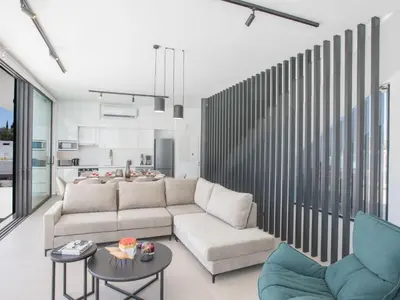 a living room with a couch and a table at Holiday Home mit Privatpool für 11 Personen ca- 220 m² in Protaras- Südküste von Zypern by Interhome in Protaras