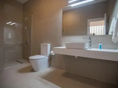a bathroom with a toilet and a sink and a shower at Holiday Home mit Privatpool für 11 Personen ca- 220 m² in Protaras- Südküste von Zypern by Interhome in Protaras