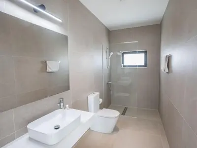 a bathroom with a white toilet and a sink at Holiday Home mit Privatpool für 11 Personen ca- 220 m² in Protaras- Südküste von Zypern by Interhome in Protaras