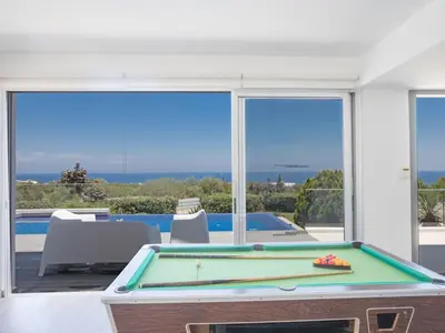 a pool table with a view of the ocean at Holiday Home Ferienvilla Chloe mit Terrasse und Garten by Interhome in Protaras