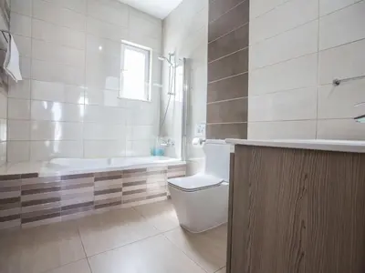 a bathroom with a toilet and a tub and a sink at Holiday Home Schöne- topmoderne Ferienvilla auf Zypern by Interhome in Protaras