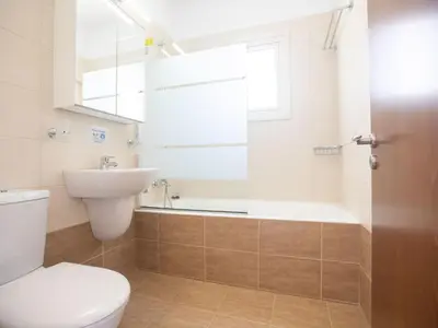 a bathroom with a toilet and a sink and a bath tub at Holiday Home Protaras Menelaos Villa MV7 by Interhome in Paralimni