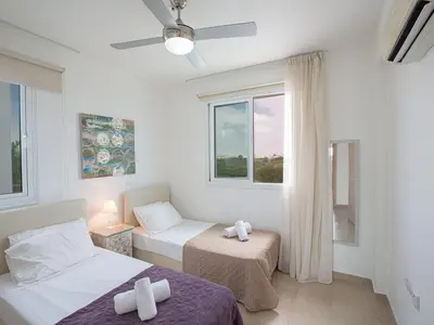 a bedroom with two beds and a window at Holiday Home 3-Schlafzimmer-Villa mit privatem Pool by Interhome in Protaras