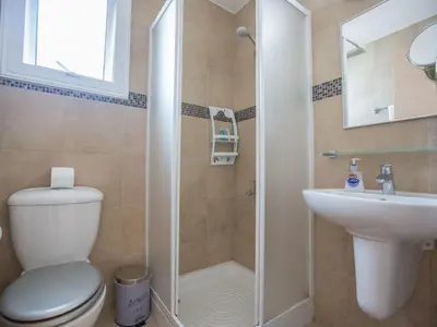 a bathroom with a shower and a toilet and a sink at Holiday Home 3-Schlafzimmer-Villa mit privatem Pool by Interhome in Protaras